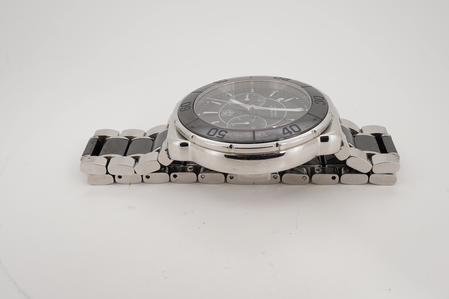 A gentleman's 2011 stainless steel TAG Heuer Formula One quartz chronograph wrist watch, on a stainless steel Tag Heuer bracelet